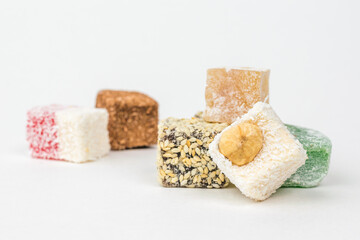 Assorted Turkish delight on a white background.