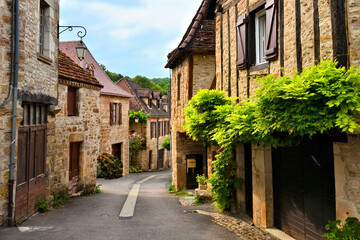 Picturesque medieval street the beautiful Dordogne village of Carennac, France