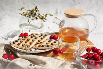 Homemade belgian waffles with berries and tea