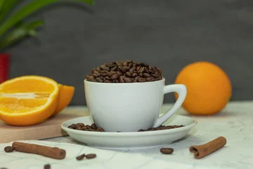 Fotobehang White coffee cup with coffee beans and cinnamon sticks © Jan Kravtsov