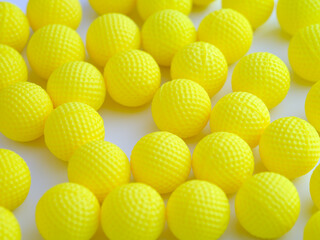 A lot of yellow balls on white background.