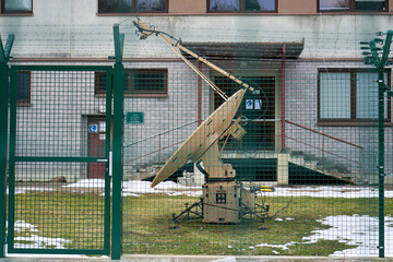 Military satellite waves receiver on the ground 