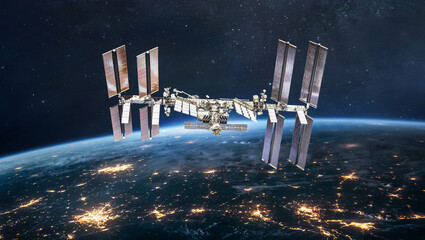 ISS station on orbit of the Earth planet. View from outer space. International space station. Earth at night. Elements of this image furnished by NASA