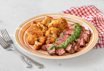 Sliced beef steak with baked cauliflower