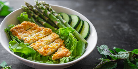 green asparagus salad chicken meat bowl  greens salad leaves eating organic diet on the table healthy food meal snack copy space food background rustic. top view