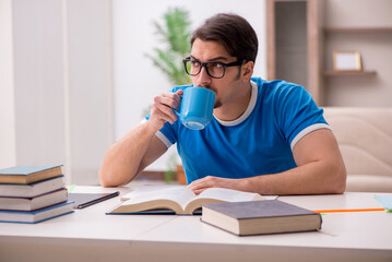 Young male student studying at home