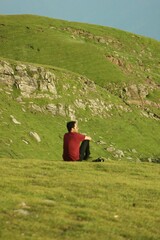 Fototapeta premium Candid shot a young male model enjoying the beauty of nature