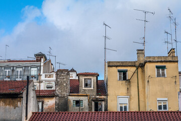 Characteristic facades of the old architecture of the center of Lisbon fill the urban scene with historic buildings.