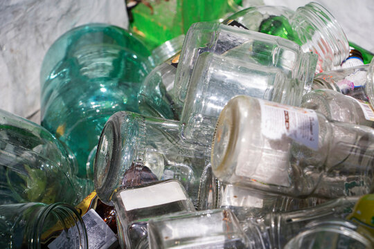 Glass jars collected for recycling. Environmental protection.