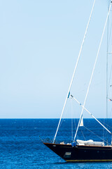 Stunning view of luxury yacht sailing on a calm, blue water. Costa Smeralda, Sardinia, Italy. Travel concept, copy space.