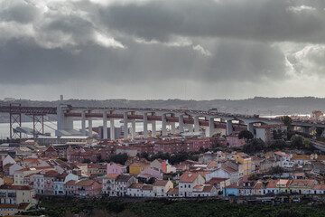 Fototapeta na wymiar Panoramic view of Lisbon city in winter day with 25 de Abril bridge in the background.
