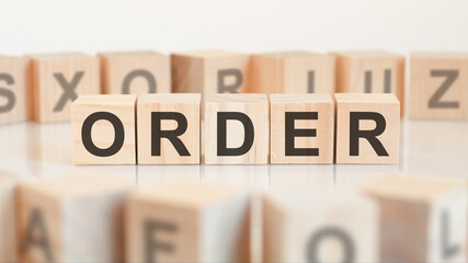 ORDER - word on wooden cubes on white background