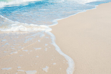 Soft sea wave on clean sandy beach