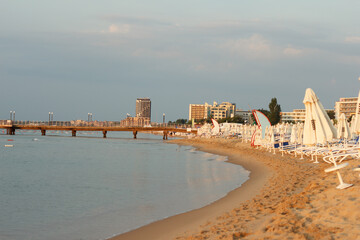 Beach and coastline against backdrop of the city in the mornings