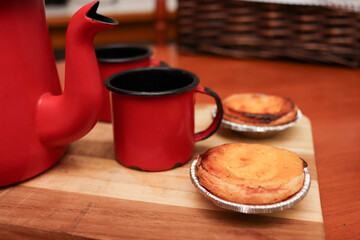 Cup of tea and cream pastry (pastel de nata)