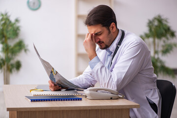 Young male doctor radiologist working in the clinic