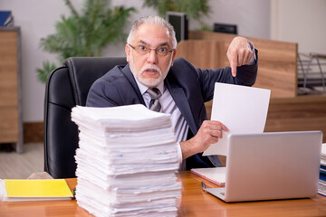 Old male employee and too much work in the office