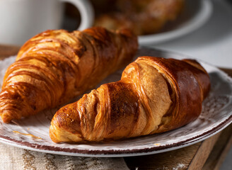 Fresh croissants on the morning rustic table