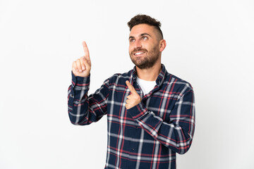Naklejka premium Caucasian man isolated on white background pointing with the index finger a great idea