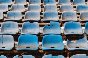 Destroyed stadium stands. Broken fan chairs. Selective focus