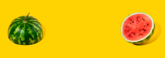 Pattern of sliced fresh watermelon on yellow background. Summer fruit, berry. Bold color. Trendy, Minimal shadows. Watermelon day concept -3 august. Copy space