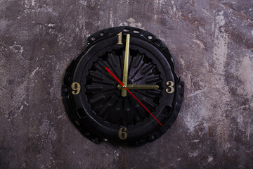 Fototapeta na wymiar homemade loft style clock made car parts metal
