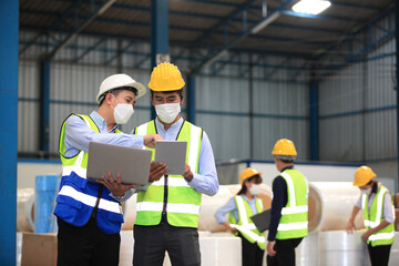 Team workers wear protective face masks for safety industrial factory. worker meeting before start working in factory or warehouse