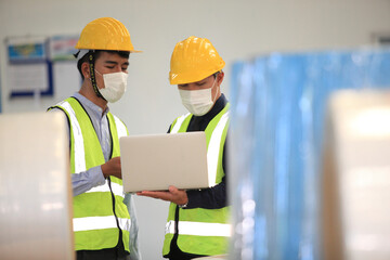 Team workers wear protective face masks for safety industrial factory. worker meeting before start working in factory or warehouse