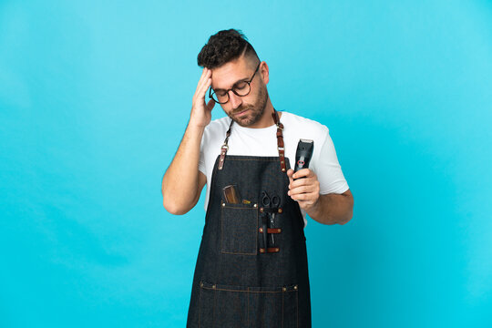 Barber man in an apron with headache