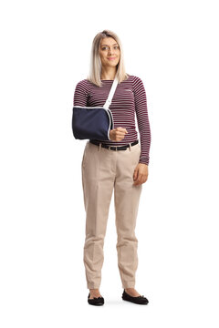 Full length portrait of a young woman with a broken arm wearing an arm splint