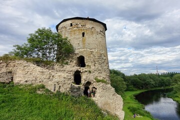 Russia. Pskov region. Pskov. The Gremyachaya Tower on the banks of the Pskova River on a summer day