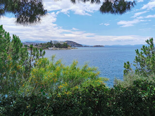 Fototapeta na wymiar Beautiful landscape with mountains, greenery and the Aegean Sea.