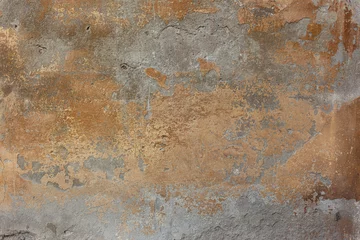 Foto op Plexiglas oude betonnen muur met bronzen verfvlekken © ginettigino