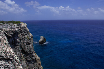 A scene of vast landscape shot from the top of the bluff in Cayman Brac - obrazy, fototapety, plakaty