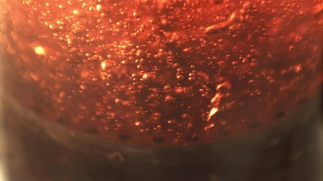 Super slow motion black tea is brewed with air bubbles. Macro background. Filmed on a high-speed camera at 1000 fps.
