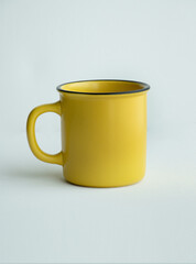 Ceramic mug Yellow on white background