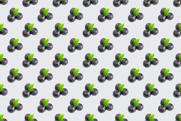 Seamless blueberry pattern on a colored background. Blueberry seamless pattern in flat minimal style