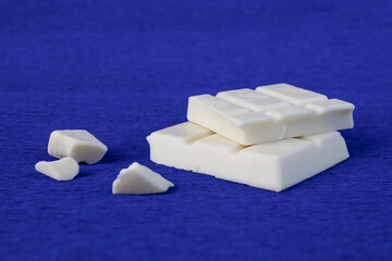 slices of white chocolate on blue crepe paper