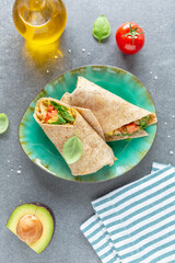 Wrapped vegetarian sandwich on plate
