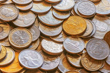 Euro coins on the table under the sunlight.