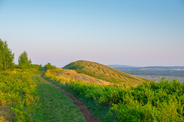 The path through the green hills.