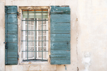 Fototapeta na wymiar Vintage window with curtain and shutters