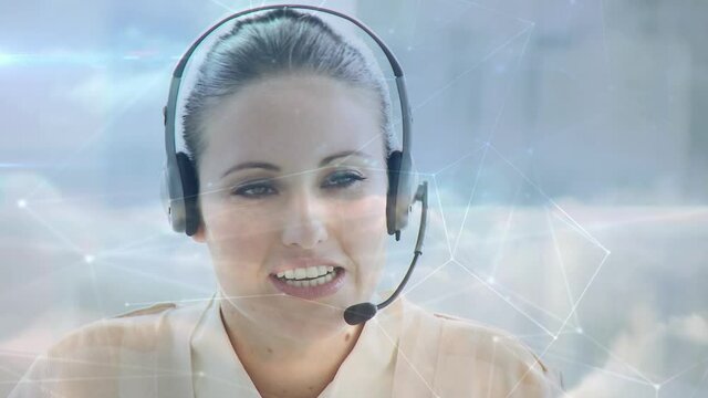 Animation of network of connections over business woman using phone headsets on blue sky