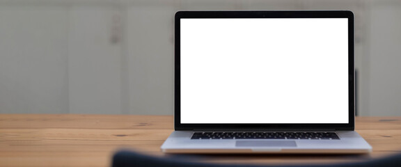 Fototapeta premium Blank screen Laptop computer and poster workspace background in modern office