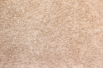 Light brown cow fur texture in patterns seamless vintage background