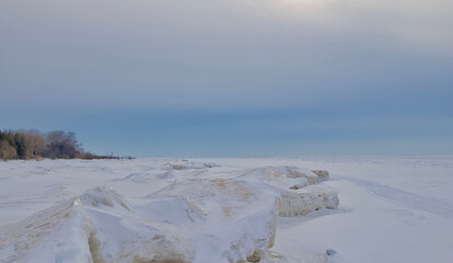 Frozen lake covered by snow like white desert