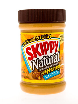 Winneconne, WI - 3 May 2015:  Jar of Skippy Natural peanut butter with honey in creamy style.