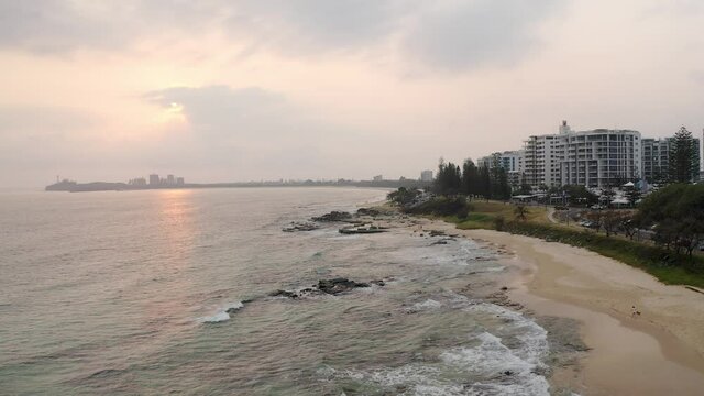 Scenic Beach Of Mooloolaba With Beachfront Holiday Apartments At Sunrise In Queensland, Australia. - aerial