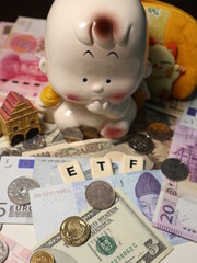 etf to invest for world and paper money around the world design for trade and wealth concept