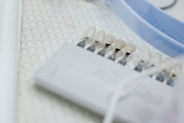 teeth on chromascope scale close up view .  teeth whitening concept